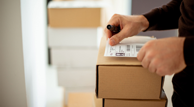 Small business owner creates shipping label