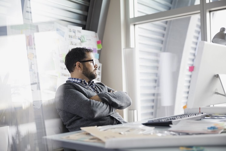 Small business owner overwhelmed by busy schedule